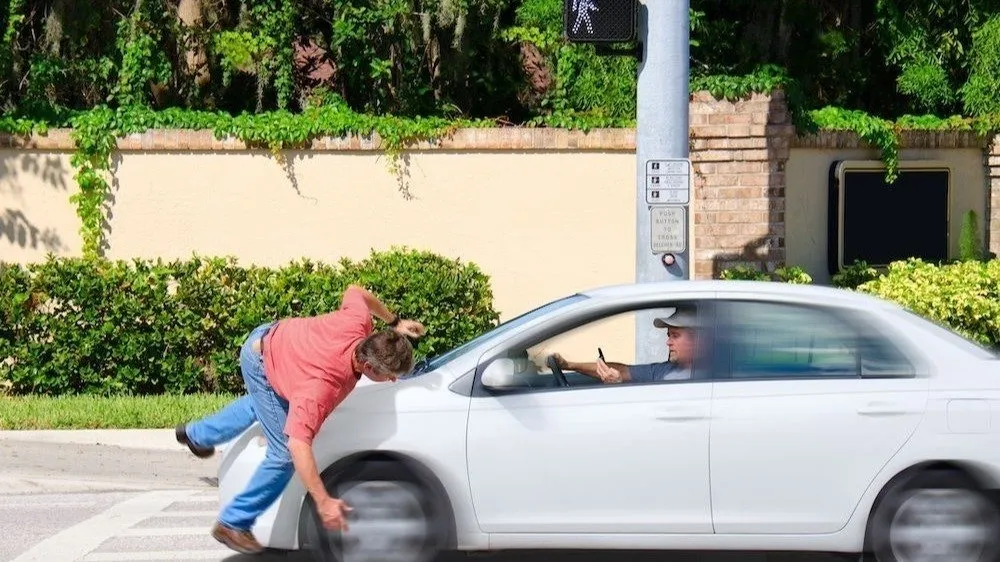 Car Strikes Pedestrian